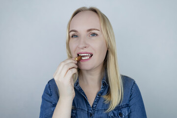 Prevention of thyroid diseases. Woman holds brazil nuts, rich in selenium, good for the thyroid...