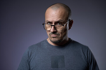 Fototapeta premium Mature man with an expression of skepticism