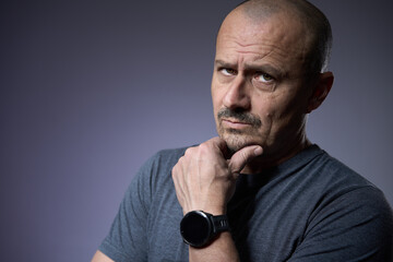 Mature man with an expression of skepticism