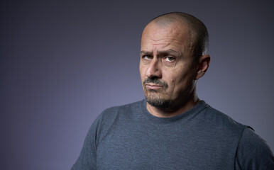 Fototapeta premium Mature man with an expression of skepticism