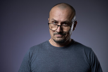 Mature man with an expression of skepticism