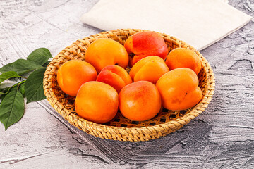 Raw ripe sweet apricots heap