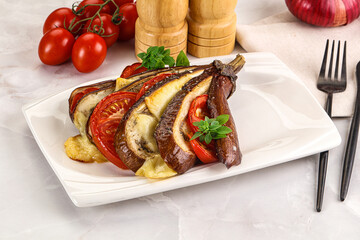 Baked tomato with mozzarella and tomato