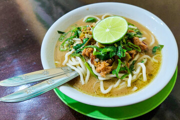 Pangsip noodles on the table and a pair of spoons and forks ready to eat