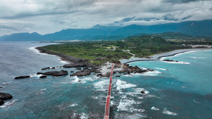 Beautiful coastal view of Sanxiantai in Taiwan featuring the stunning bridge at sunset
