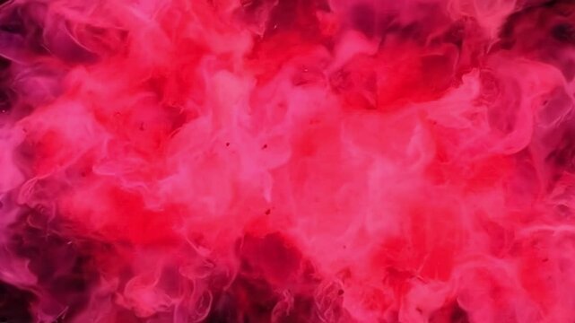 Colorful smoke effect swirling in red and pink tones for artistic creation