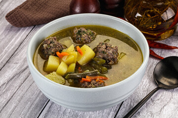 Soup with beef meatballs and vegetables
