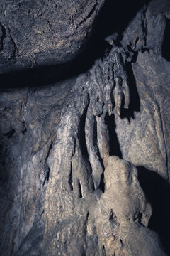 A rock with an irregular shape extends downwards like a sheet of cloth in the Bukit Buntu Kesu Tana Toraja cave