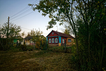 Old house in the village in autumn