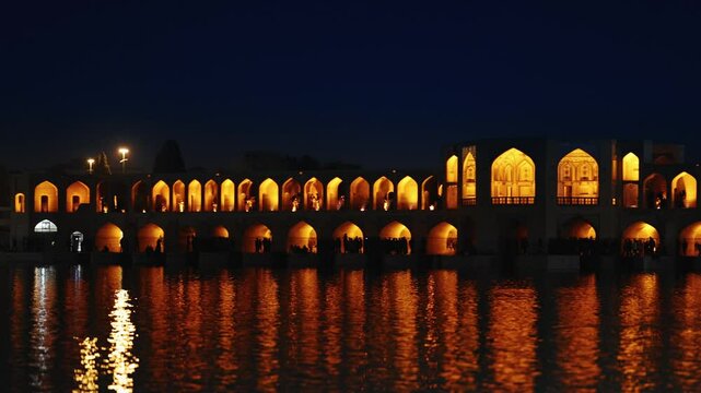 The breathtaking and timeless beauty of Khaju Bridge in Isfahan, Iran, is a 17th-century architectural icon. After sunset, the stunning view of the bridge reflected in the waters of Zayandeh River