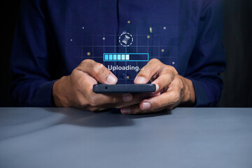 Man using a smartphone to upload data to cloud storage. Phone data backup and cloud data storage concept.
