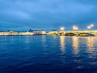 Obraz premium Night city riverside, city lights at the river, blue twilights