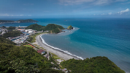 Stunning coastal view of Nanfangao in Taiwan showcasing the beach and lush green hills