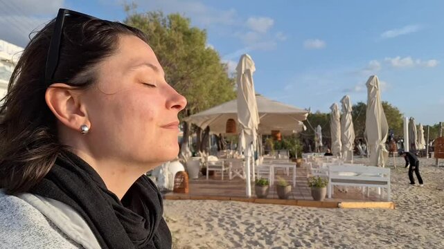 Woman enjoying the sun set on Paros Island, Greece