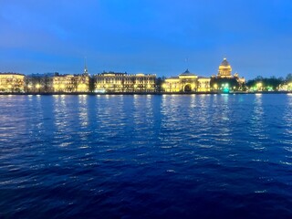 Fototapeta premium Night city riverside, city lights at the river, blue twilights