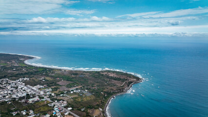 Scenic coastal view of Taiwan shoreline featuring lush land and calm blue ocean waters