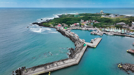 Aerial view of a scenic harbor and coastal landscape in Taiwan during a clear day