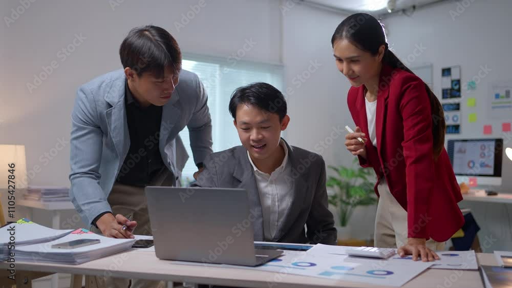 Poster business team collaborating and analyzing data around a laptop in a modern office setting, strategiz