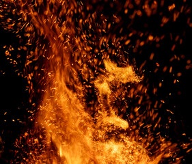 fire flame with sparks on black background.