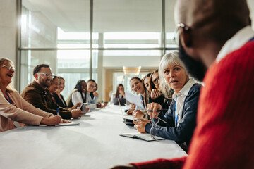 Diverse group of professionals brainstorming in a collaborative meeting in a modern office space