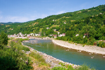 tysa river running through the valley. peaceful morning. sunny weather in summer. mountainous countryside landscape of rakhiv region in ukraine. wonderful highlands