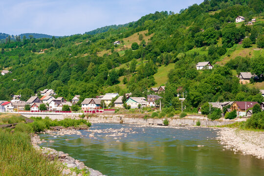 tysa river running through the valley. stones on the shore. sunny weather in summer. mountainous countryside landscape of rakhiv region in ukraine. picturesque travel destination