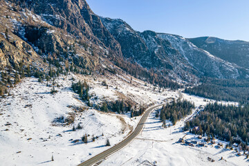 Early morning sunrise in steppes. Snow-covered pasture in the Altai Republic. onset of winter, snow cover.