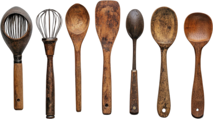 Wooden cooking utensils arranged artistically against a transparent background showcasing rustic kitchen charm and timeless craftsmanship