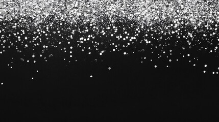 A soft, glittering effect of silver confetti scattered evenly at the top of a midnight black background, with a blank area below for text