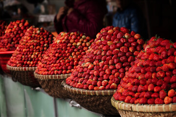 Close up shot of strawberries at a market stall