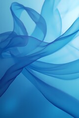 Fototapeta premium Abstract background made of translucent blue silk fabric