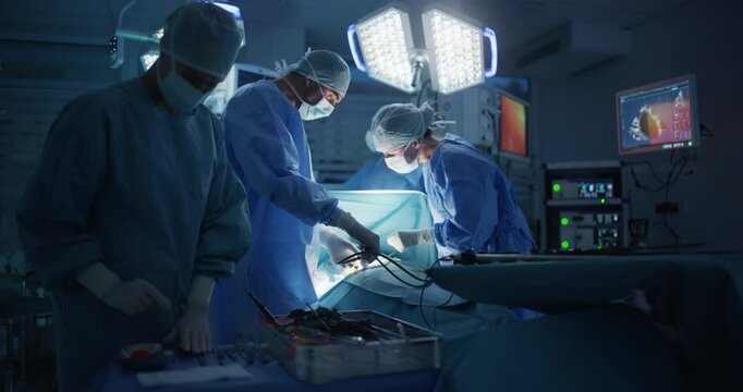 Deep in the Process of an Emergency Surgery, Diverse Team of Healthcare Professionals Navigating Each Stage of the Operation with Extreme Concentration, Uniting Their Skills to Perform the Procedure