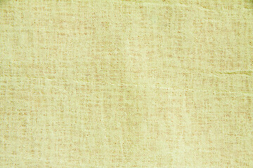 ファブリックの背景素材（淡く渋い黄色）