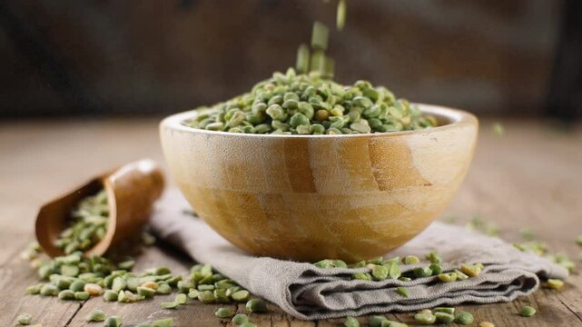 raw green split pea dropping into bowl