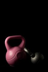 Kettlebells on a black background.