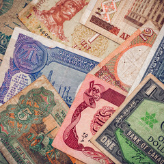 Background from paper money of the different countries.financial economy background for desktop wallpaper. Money Texture.The concept of wealth, profits, business, finance.
