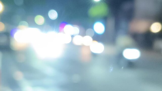 blurred, defocused, missed focus video background with the theme of a night atmosphere of passing vehicles