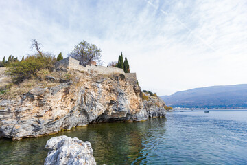 Tranquil Waters and Rugged Rocky Shoreline of Lake Ohrid, North Macedonia