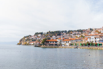 Obraz premium Picturesque view of Ohrid, a historic town nestled on the shores of Lake Ohrid. Charming architecture, and stunning lake views ,popular tourist destination. North Macedonia