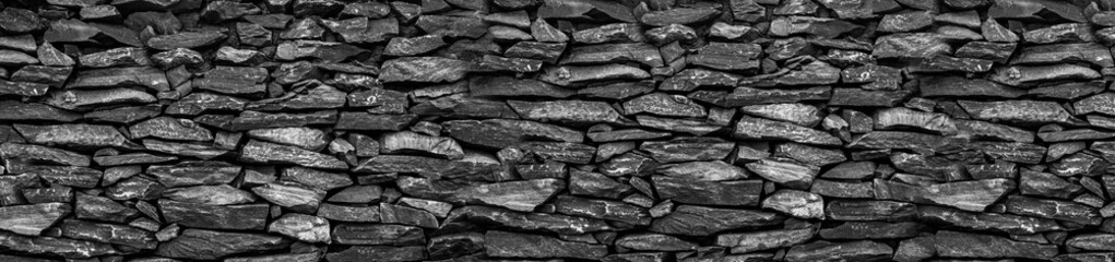 a stone wall with a stone in the middle.