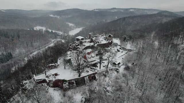 Aerial view ruins of old castle. Winter. Ruin of Hohnstein Castle, Harz mountains, Germany.