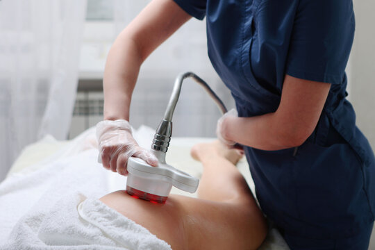 Anti-cellulite massage with an ultrasound machine of hip area. RF-lifting procedure. Hardware cosmetology. Hardware rejuvenation of body.