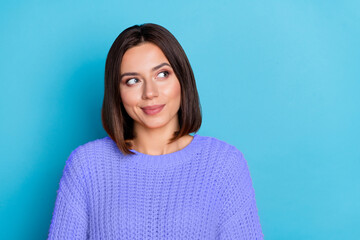 Fototapeta premium Portrait of attractive cheerful bewildered girl deciding copy empty space isolated over bright blue color background