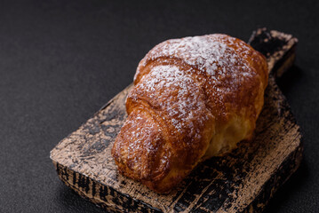 Fresh crispy sweet croissant with chocolate filling