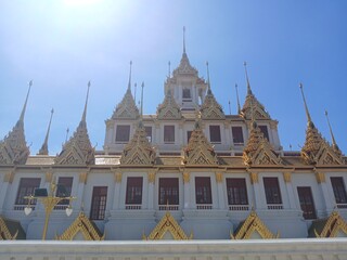 Naklejka premium metal caltle or Loha Prasat in Wat Ratchanatdaram, blue sky