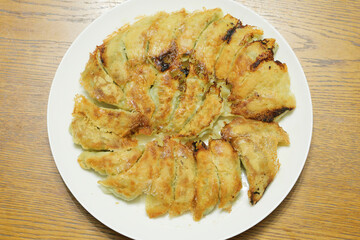 General home cooked baked dumplings, with an abundance of vegetables and garlic as ingredients