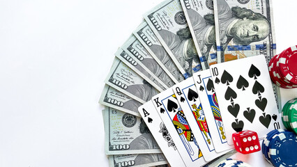 Fototapeta na wymiar Poker chips, playing cards showing a royal flush in spades, red dice, and US dollar bills placed on a white background, representing gambling, luxury, and high-stakes poker. Ideal for casino advertise