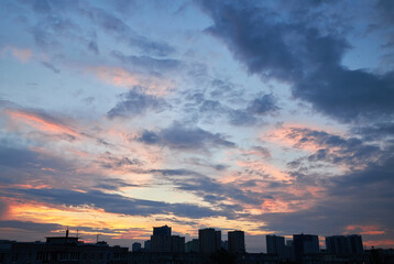 Colorful Sunset Sky with Clouds Over City