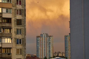 Apartment Buildings with Stormy Sky at Sunset