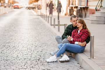 A Romantic Moment: A Couple Enjoying Intimacy on a Cobblestone Street